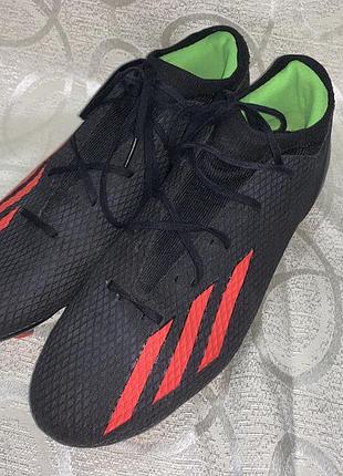 Чоловічі чорні футбольні бутси adidas x speedportal.3 fg із яскраво-червоними смужками та салатовою підкладкою