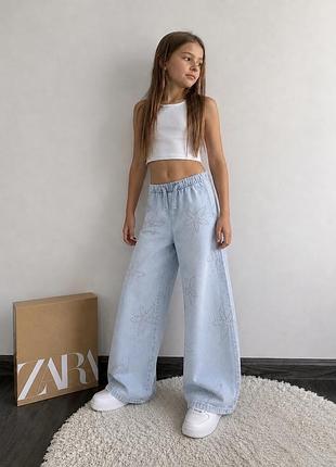 Джинси голубі зі стразами zara