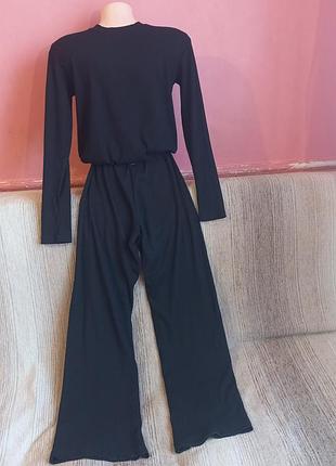 Жіночий трикотажний костюм в рубчик (лонгслів + штани палаццо), розмір 44