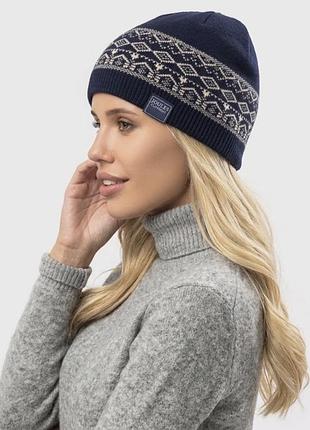 Joules нова жіноча демілітаризована в'язана шапка-біні  синя з геометричним малюнком