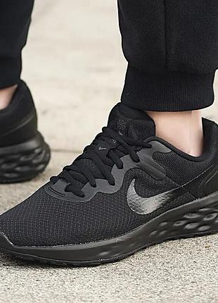 Вживані чоловічі бігові кросівки nike revolution у чорному кольорі 48,5р/32см