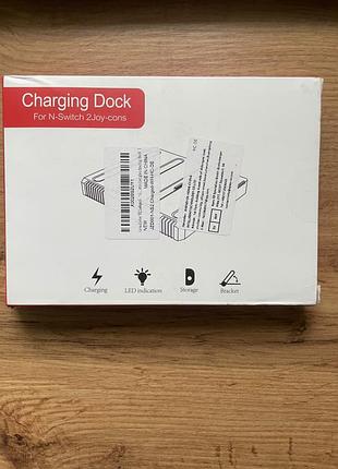 Зарядна док-станції ns2 joy-con charging dock, яка призначена для одночасного заряджання до чотирьох контролерів joy-con.