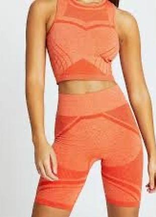 Помаранчеві спортивні велошорти river island riactive s