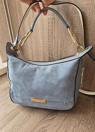 Жіноча брндова сумочка river island.