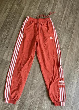 Штани жіночі adidas помаранчевого кольору з лампасами. розмір uk 8(підійде на хс/с невелику м)