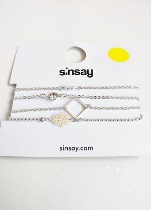Новый комплект серебристых браслетов sinsay