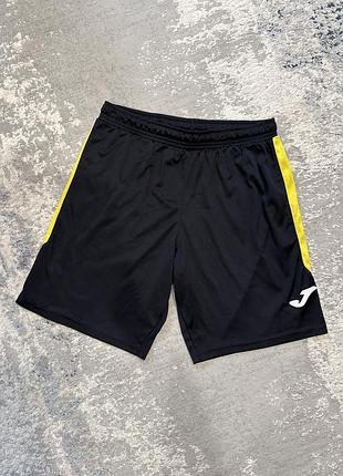 Шорти чорні з жовтим joma s