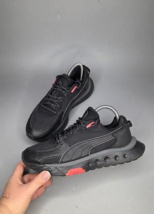 Чорні кросівки puma wild rider grip ls з червоними акцентами на підошві та язичку