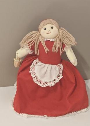 Винтажная текстильная кукла-перевёртыш (англ. topsy-turvy doll), которая изображает героиню сказки «красная шапочка».