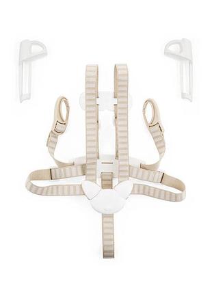 Система фіксації дитини stokke