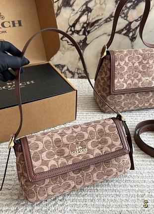 Жіноча маленька сумка з елементами еко шкіри coach