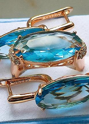 Изысканные серьги 585 проба с голубыми цирконами