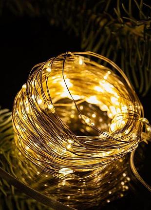 Гирлянда роса нить 100 led на батарейках 10 м теплый желтый 2шт