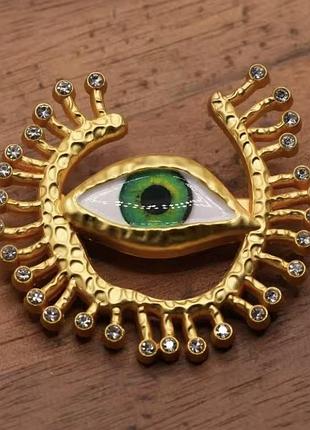 Брошь в виде глаза с кристаллами