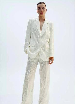 Брюки блискучі молочні zara