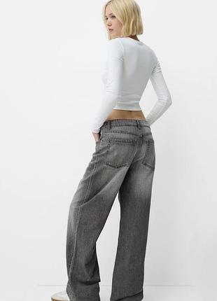 Широкі джинси bershka
