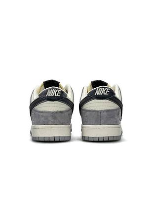 Nike sb dunk low x kaws grey beige 4