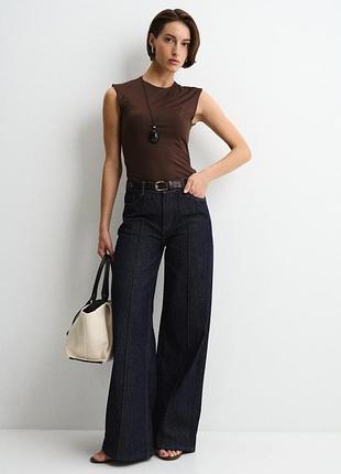 Темно-сині (індиго) жіночі джинси бренду zara з високою посадкою, декоративними центральними швами-стрілками та розкльошеним силуетом wide leg