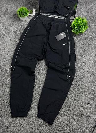 Нейлоновые брюки nike reflective 4