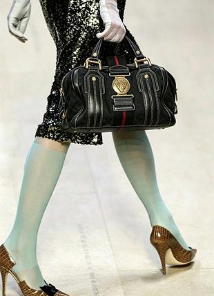 У моїй сумці живе цілий світ:  gucci