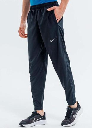 Штаны мужские nike stripe woven pant bv4840-010 черные