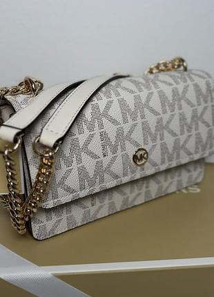 Жіноча маленькая сумка michael kors світлого кольору