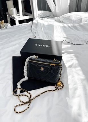 Chanel mini vanity case in black lambskin with gold-tone hardware and ball charm chain 17х10х8