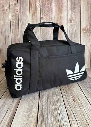 Дорожня сумка adidas 50×24×24 см чорна з тканини oxford 1000d з плечовим ременем