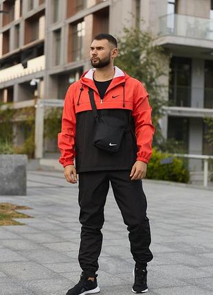 Мужской костюм nike, повседневный комплект черные штаны с манжетами, оранжево-черный анорак с регулируемым капюшоном, барсетка xl