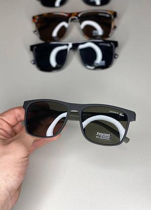 Солнцезащитные очки lacoste унисекс черная оправа uv400 защита чорний/хакі