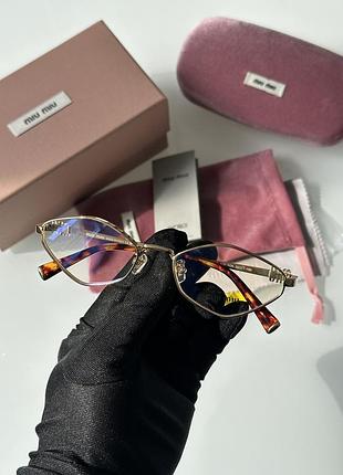 Окуляри miu miu з прозорими лінзами та золотистою оправою в коробці