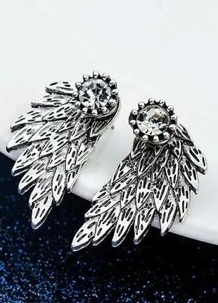 Сережки-цвяшки з каменем крила легкості золотисті