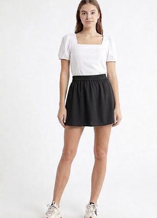 Prettylittlething нова коротка жіноча спідниця  чорного кольору підійде для школи розмір xxs-xs