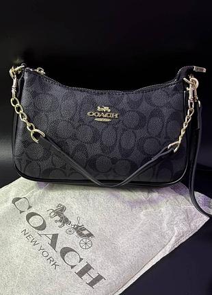 Сумка coach у чорному кольорі
стильна та якісна сумка, яка гарно підійде на подарунок та доповнить будь-який образ.