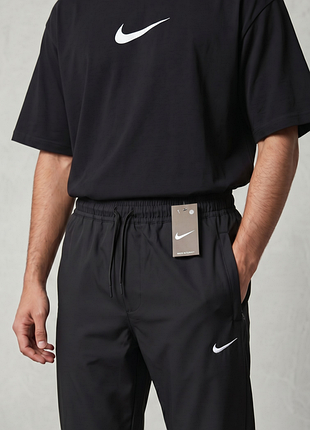 Мужские брюки nike черные манжет (белое лого вышивка) xl