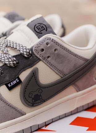 Nike sb dunk × kaws
• grey / cream • 4