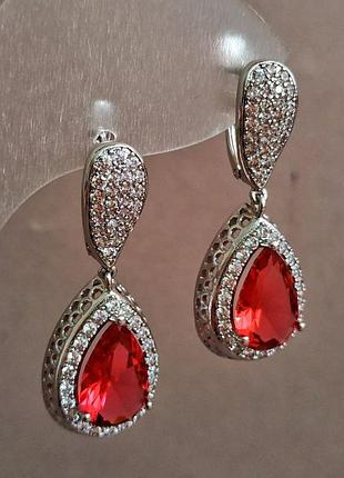 Сережки xuping родій із білими стразами та червоним кристалом d-35х14мм+ -
