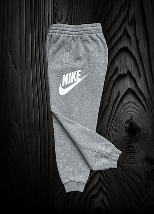 Утеплені оригінальні штани nike на 10-11 років