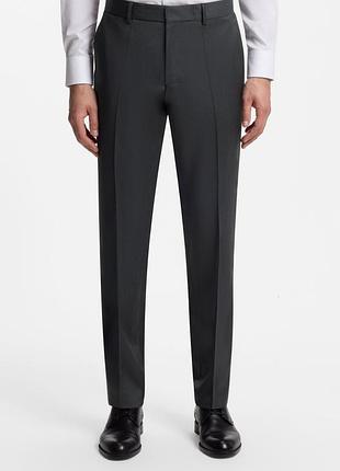 Сучасні штани брюки вовняні hugo boss з манжетом. розмір 34.