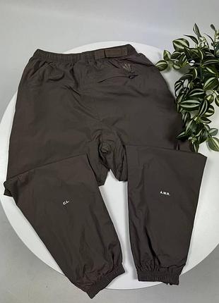 Нейлоновые брюки nike notta черные
