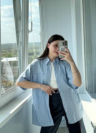 Вінтажна блакитна сорочка в смужку з чоловічого плеча lacoste