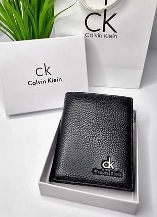 Мужской кошелек вертикальный кожаный черный calvin klein портмоне с прозрачным окошком для документов без застежки