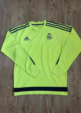 Чоловіча світшот-треніровка adidas real madrid сезону 2015–2016 років яскраво-жовтого кольору (solar yellow) з темно-синіми деталями та емблемою клубу