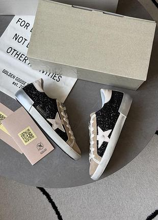 Golden goose super-star in black glitter with cream star and suede inserts