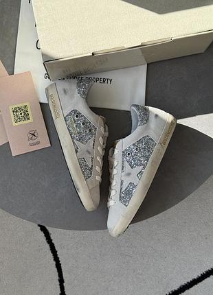 Golden goose super-star in silver glitter with ice-gray star and inserts