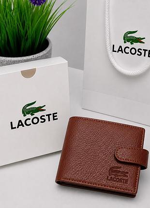 Коричневе портмоне чоловіче lacoste брендовий шкіряний гаманець на кнопці з прозорим віконцем для докуметів і прав з монетницею