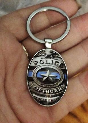 Овальний брелок на ключі офіцер police поліція the police