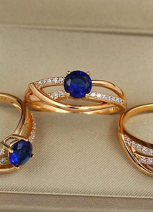Кольцо xuping jewelry волны с синим камнем р 19 золотистое