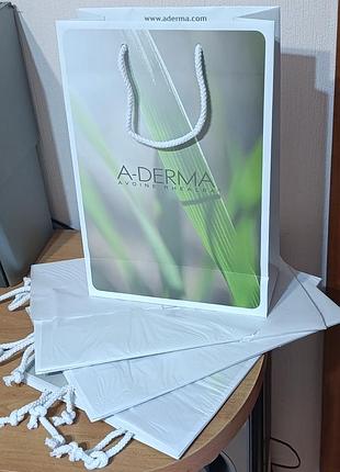 Паперові пакети з ручками білі a-derma (французька косметика) опт люкс якість матеріалу упаковка