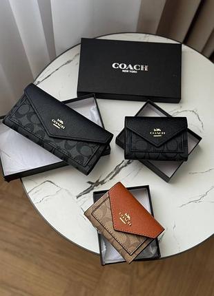 Гаманці жіночі coach чорні та коричневі з екошкіри